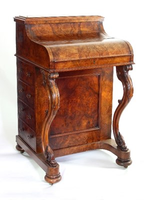 Lot 623 - A mid-Victorian figured walnut piano-top...