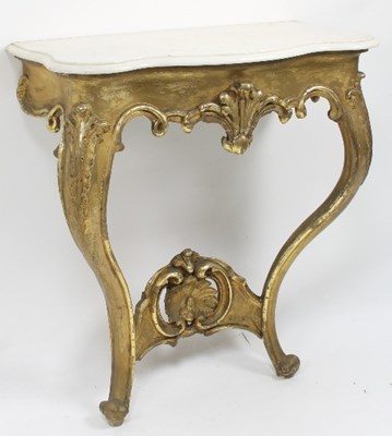 Lot 625 - A carved giltwood and plaster marble topped...