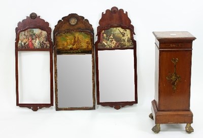 Lot 627 - A walnut wall mirror with carved surround, the...