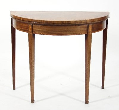 Lot 638 - A Regency walnut demi-lune card table with...