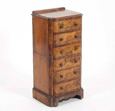 Lot 649 - A small walnut pedestal chest of six drawers,...