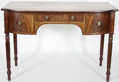 Lot 657 - A Regency walnut dressing table fitted with...