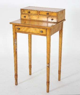 Lot 660 - A Regency satinwood work table with ebony...