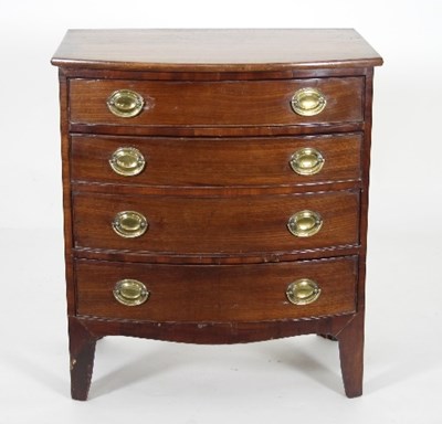 Lot 670 - A Regency mahogany bowfront chest of four long...