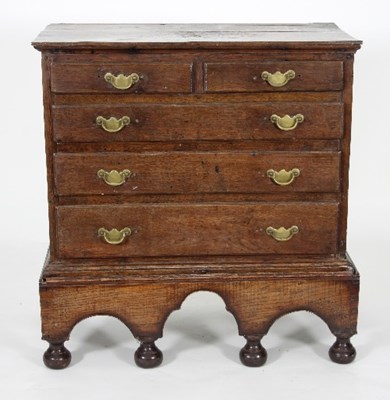 Lot 672 - An 18th Century fruitwood chest on stand...