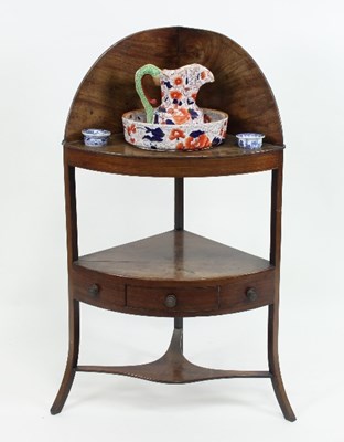 Lot 674 - A 19th Century walnut corner washstand of two...