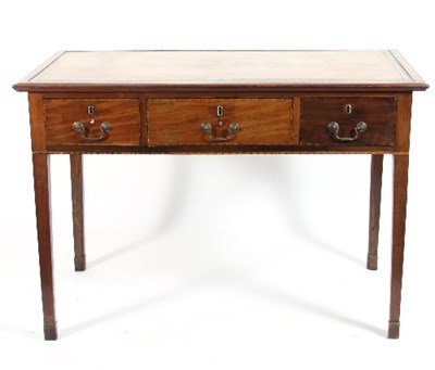 Lot 680 - A George III mahogany writing table, circa...