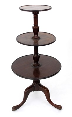 Lot 688 - A George III mahogany three-tier dumb waiter,...