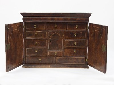 Lot 692 - A William and Mary walnut cabinet, the moulded...