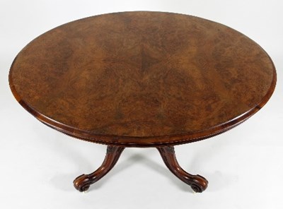 Lot 696 - A Victorian figured walnut oval table, raised...