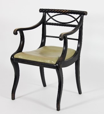 Lot 710 - A Regency ebonised open armchair, with rope...