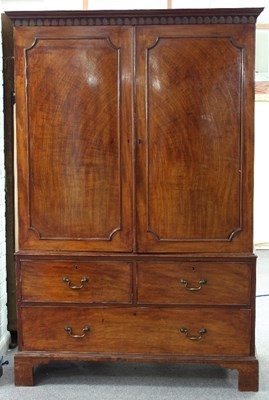 Lot 724 - A George III mahogany linen press, adapted for...