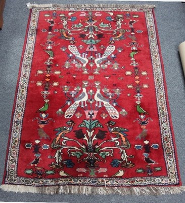 Lot 746 - A modern Hamadan rug worked with animals,...