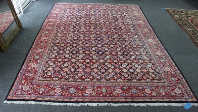 Lot 752 - A Mahal rug, the indigo herati field enclosed...