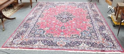 Lot 754 - A modern Mashad carpet with central navy blue...