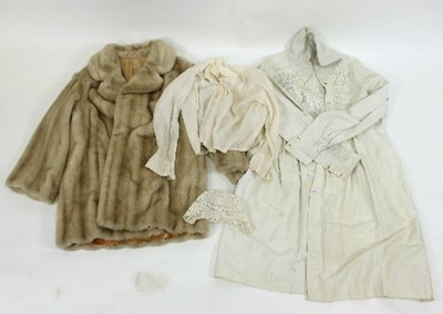 Lot 766 - A cotton smock, a baby's lace bonnet, a faux...