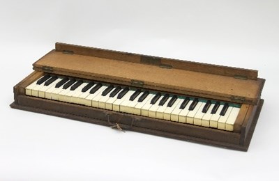 Lot 794 - A silent piano keyboard, in an oak case with...