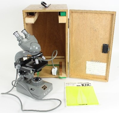 Lot 818 - An Olympus KHC electric biological microscope,...