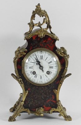 Lot 827 - A 19th Century boulle type mantel clock in a...