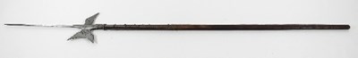 Lot 836 - A steel halberd on a wooden shaft with shaped...