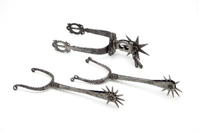 Lot 843 - A near pair of 18th Century steel spurs with...