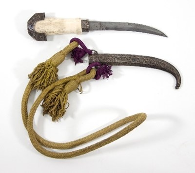 Lot 844 - A Middle Eastern bone hilted dagger with white...