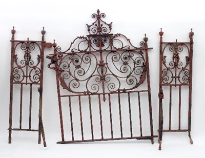 Lot 8 - A wrought iron garden gate with scrollwork...