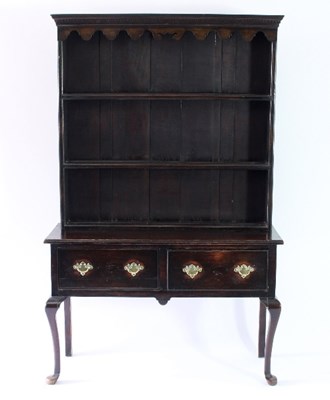 Lot 30 - An 18th Century style oak dresser with shaped...