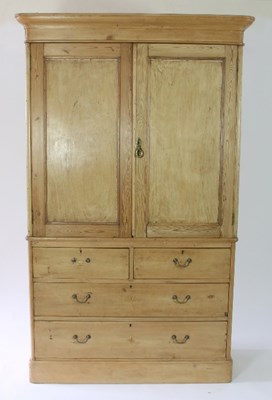 Lot 37 - A Victorian pine linen press, the panel doors...