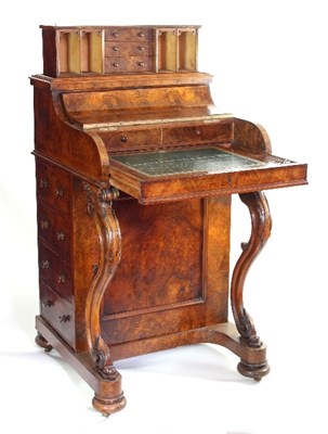 Lot 64 - A mid Victorian figured walnut piano-top...