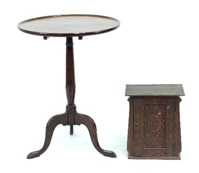 Lot 69 - A mahogany circular table on a turned column...