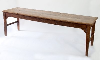 Lot 70 - An elm refectory table on square taper legs...