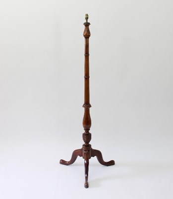 Lot 72 - A turned wood standard lamp on a tripod...