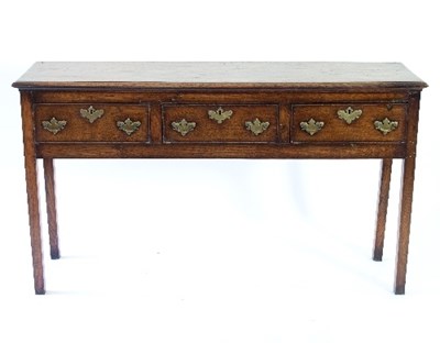 Lot 73 - An 18th Century style oak dresser fitted three...