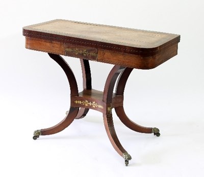 Lot 75 - A Regency rosewood and brass inlaid card table...