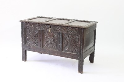 Lot 84 - An 18th Century oak chest with triple panel...