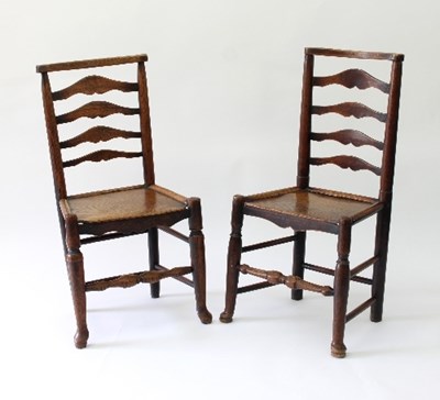 Lot 88 - A near pair of ladder back chairs with solid...