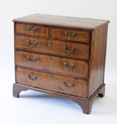 Lot 98 - An 18th Century walnut chest of three long and...