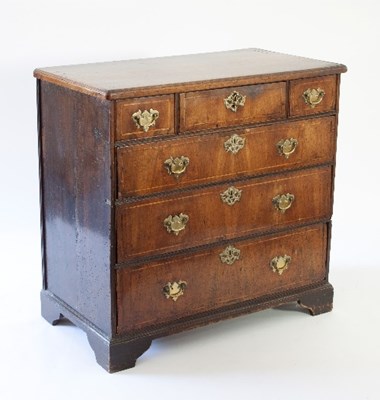 Lot 102 - An 18th Century walnut chest of three long and...