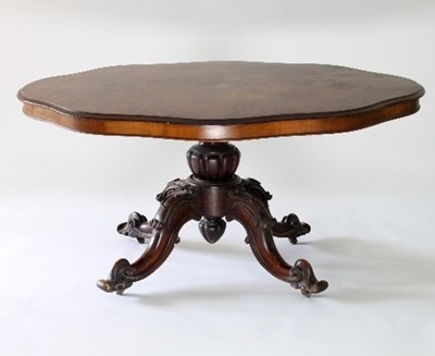 Lot 109 - A Victorian shaped oval figured walnut...