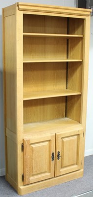 Lot 118 - A modern oak bookcase, the upper section...