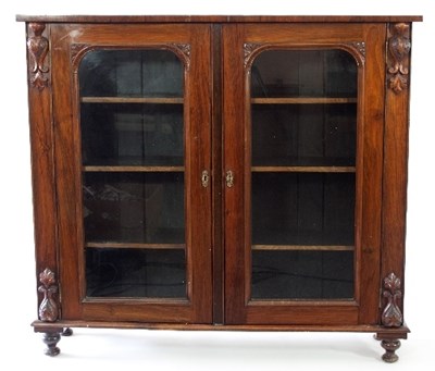 Lot 119 - A Victorian rosewood bookcase enclosed by a...