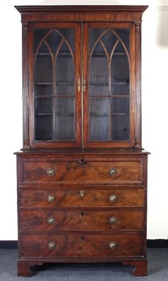 Lot 124 - A George III mahogany secretaire bookcase, the...