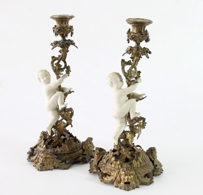 Lot 147 - A pair of gilt metal and parian porcelain...