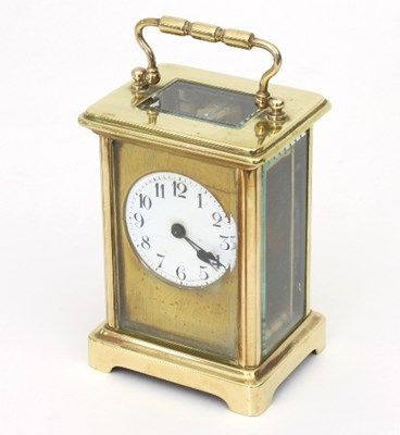 Lot 189 - A gilt brass cased carriage clock, the white...