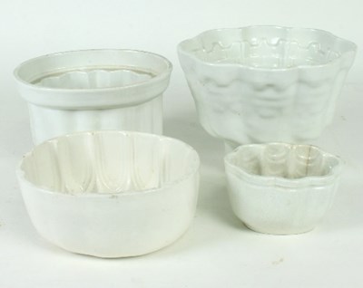 Lot 227 - Four white glazed jelly moulds, a Davenport...