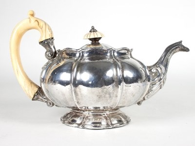 Lot 333 - A George IV melon-shaped silver teapot,...