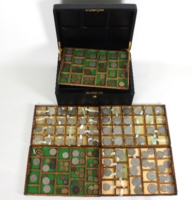 Lot 417 - A leather case fitted five trays of coins,...