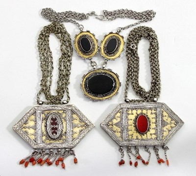 Lot 440 - Two Afghan pendant necklaces, each of lozenge...