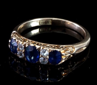 Lot 482 - A sapphire and diamond ring, the three...